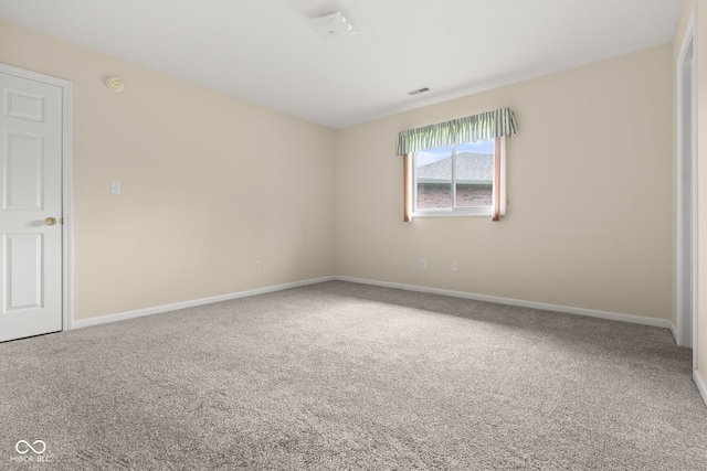 1309 Wyoming Way, Anderson, IN 46013 - carpeted spare room with baseboards and a smoke detector