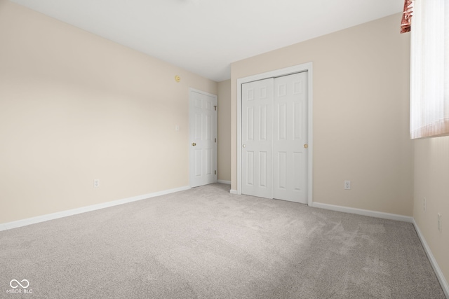 1309 Wyoming Way, Anderson, IN 46013 - unfurnished bedroom featuring light carpet and a closet