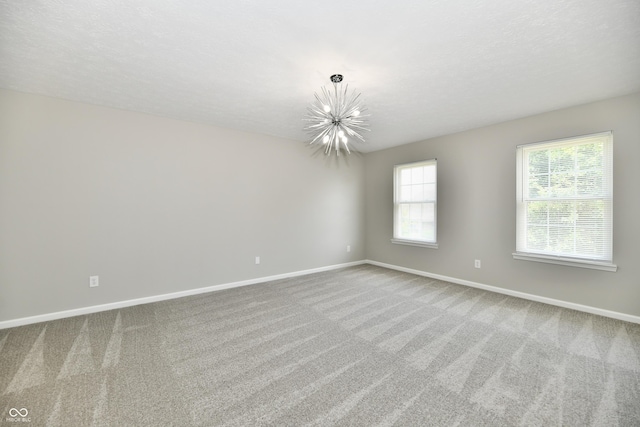 5759 Columbia Cir S, Greenwood, IN 46142 - carpeted spare room featuring a chandelier and healthy amount of natural light