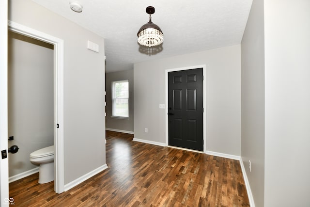 5759 Columbia Cir S, Greenwood, IN 46142 - foyer entrance featuring wood finished floors and a chandelier