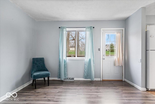 6120 E Southport Rd, Indianapolis, IN 46237 - unfurnished room with wood finished floors and a textured ceiling