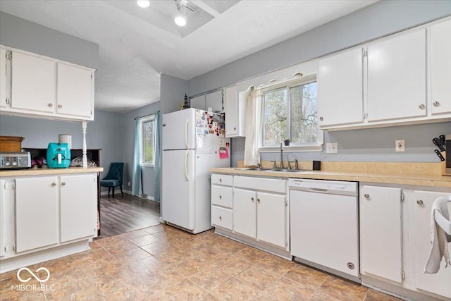 6120 E Southport Rd, Indianapolis, IN 46237 - kitchen featuring white appliances, light countertops, and white cabinets