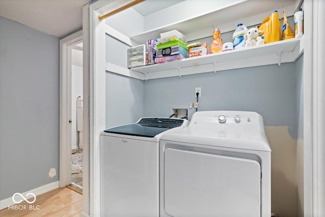 6120 E Southport Rd, Indianapolis, IN 46237 - laundry area with washer and dryer and wood finished floors