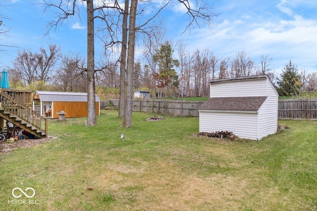 6120 E Southport Rd, Indianapolis, IN 46237 - fenced backyard with a shed and stairway
