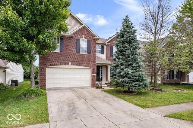 8877 N White Tail Trl, Mccordsville, IN 46055 - traditional home with brick siding, a front lawn, an attached garage, and driveway