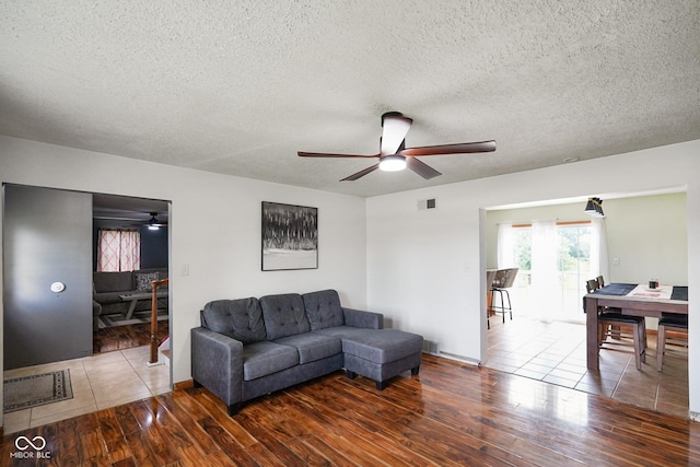 13041 S Finer St, Pimento, IN 47866 - living room featuring ceiling fan, wood finished floors, and a textured ceiling