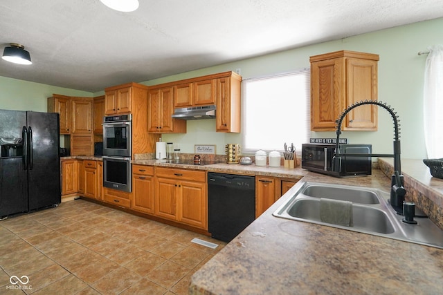 13041 S Finer St, Pimento, IN 47866 - kitchen featuring black appliances, under cabinet range hood, brown cabinetry, and light countertops