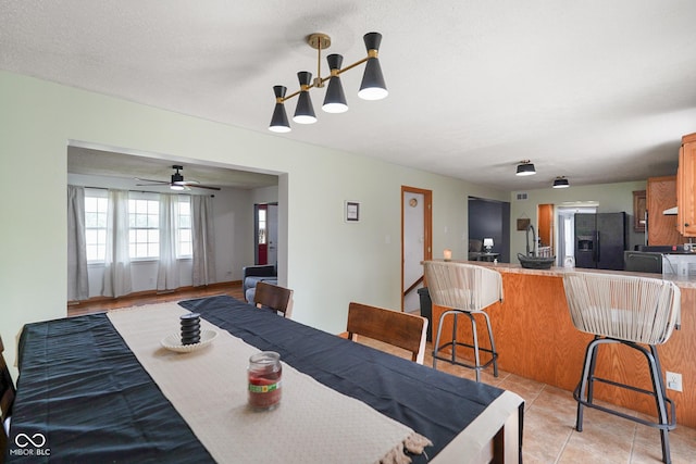13041 S Finer St, Pimento, IN 47866 - dining room with a ceiling fan and light tile patterned floors