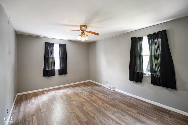 13041 S Finer St, Pimento, IN 47866 - spare room with wood finished floors and a ceiling fan