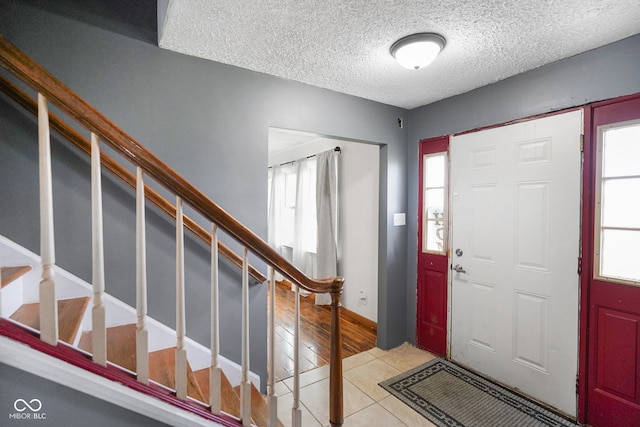 13041 S Finer St, Pimento, IN 47866 - tiled entryway featuring a textured ceiling and stairs