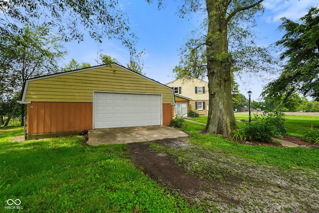 13041 S Finer St, Pimento, IN 47866 - view of front facade with a garage, an outbuilding, driveway, and a front lawn