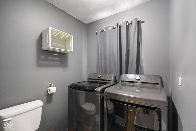 13041 S Finer St, Pimento, IN 47866 - laundry area featuring washer and clothes dryer and a textured ceiling