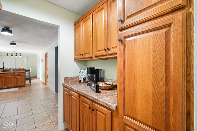 13041 S Finer St, Pimento, IN 47866 - kitchen with light tile patterned flooring and brown cabinets