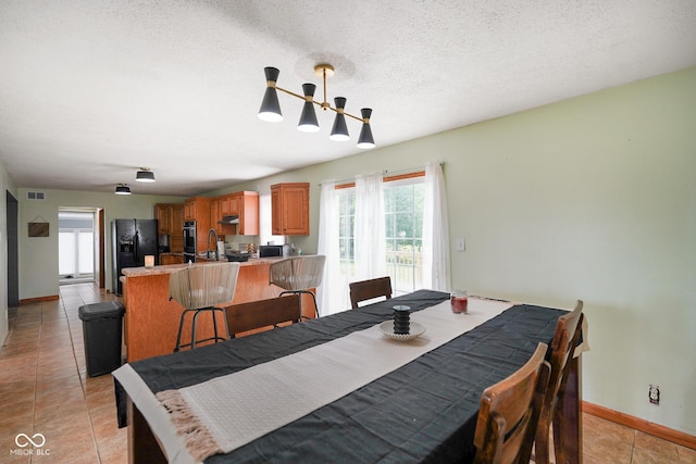 13041 S Finer St, Pimento, IN 47866 - dining room featuring light tile patterned flooring and a textured ceiling