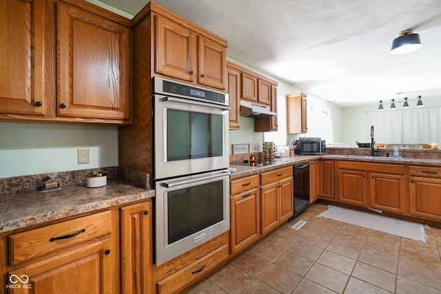 13041 S Finer St, Pimento, IN 47866 - kitchen with black appliances, brown cabinetry, tile patterned floors, and dark countertops