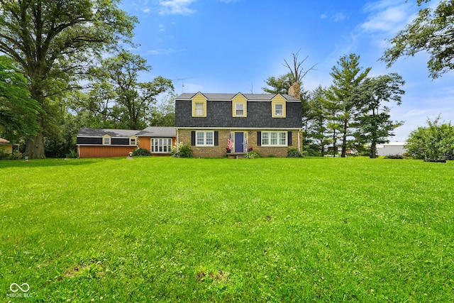 13041 S Finer St, Pimento, IN 47866 - dutch colonial featuring a chimney, a front lawn, and brick siding