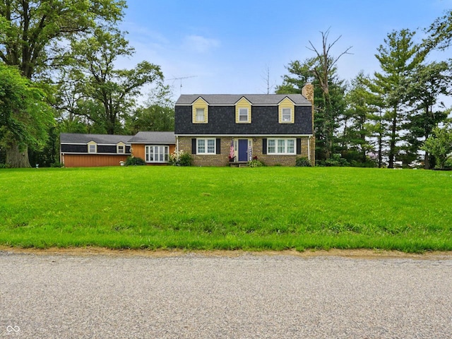 13041 S Finer St, Pimento, IN 47866 - colonial inspired home with a chimney, a front lawn, and brick siding