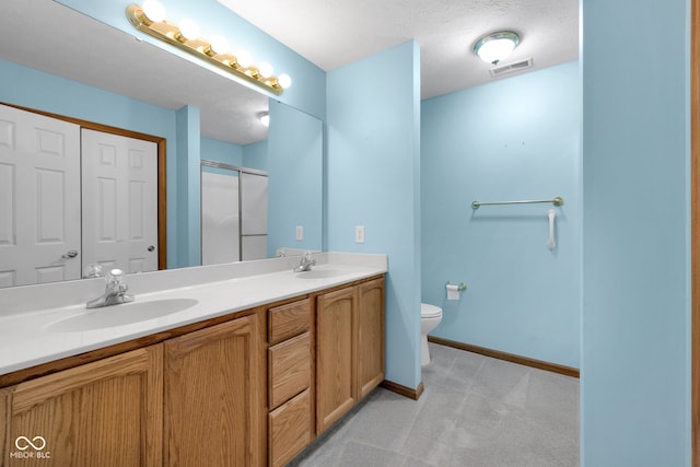 9735 Woodsong Ln, Indianapolis, IN 46229 - bathroom with double vanity and a shower with door