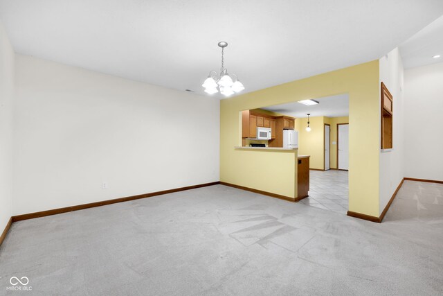 9735 Woodsong Ln, Indianapolis, IN 46229 - unfurnished living room with light carpet and a chandelier