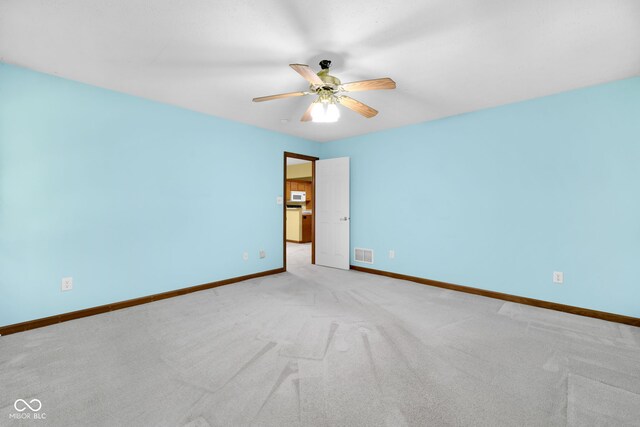 9735 Woodsong Ln, Indianapolis, IN 46229 - carpeted empty room featuring baseboards and a ceiling fan