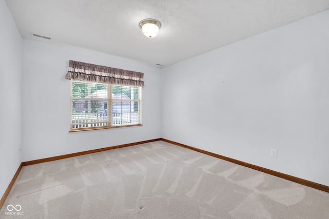 9735 Woodsong Ln, Indianapolis, IN 46229 - carpeted empty room with baseboards and a textured ceiling