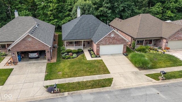 9735 Woodsong Ln, Indianapolis, IN 46229 - traditional-style house featuring driveway, a chimney, brick siding, and covered porch