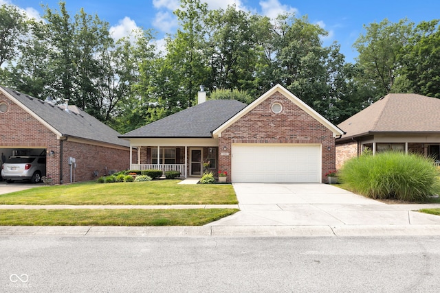 9735 Woodsong Ln, Indianapolis, IN 46229 - view of front of home with brick siding, an attached garage, a front lawn, driveway, and covered porch