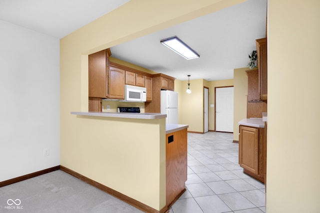 9735 Woodsong Ln, Indianapolis, IN 46229 - kitchen featuring white appliances, light countertops, a peninsula, and hanging light fixtures