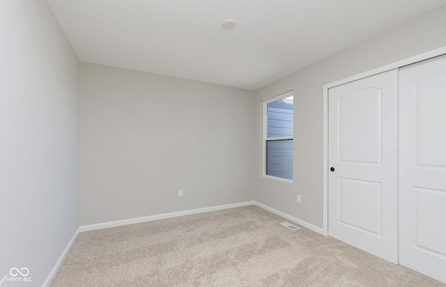 9737 Oleander Dr, Fishers, IN 46250 - unfurnished bedroom featuring light colored carpet and a closet