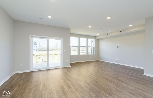 9737 Oleander Dr, Fishers, IN 46250 - empty room featuring wood finished floors and recessed lighting
