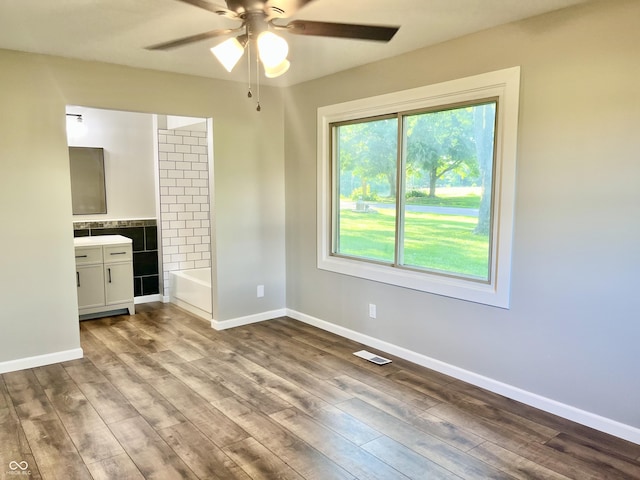 15841 E 265 N, Columbus, IN 47203 - unfurnished bedroom with wood finished floors, ensuite bath, and ceiling fan