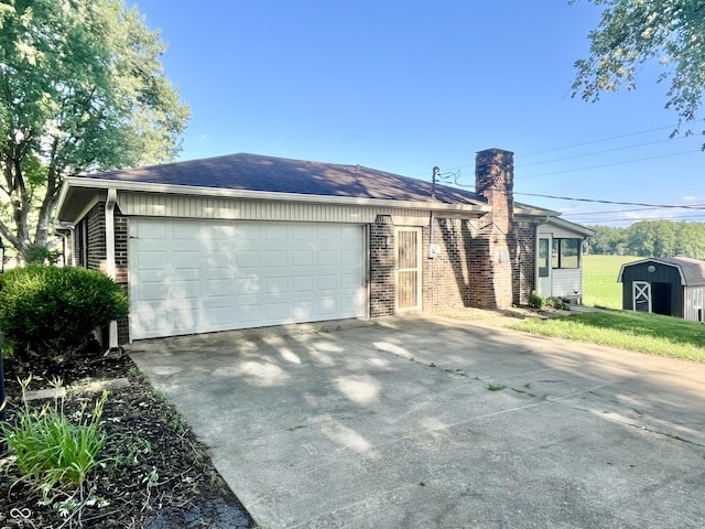 15841 E 265 N, Columbus, IN 47203 - ranch-style house featuring brick siding, concrete driveway, a chimney, a shed, and a garage