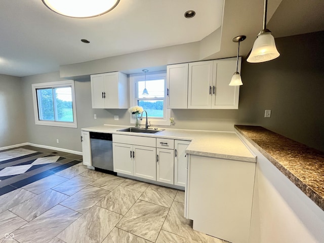 15841 E 265 N, Columbus, IN 47203 - kitchen with stainless steel dishwasher, white cabinets, decorative light fixtures, and light countertops
