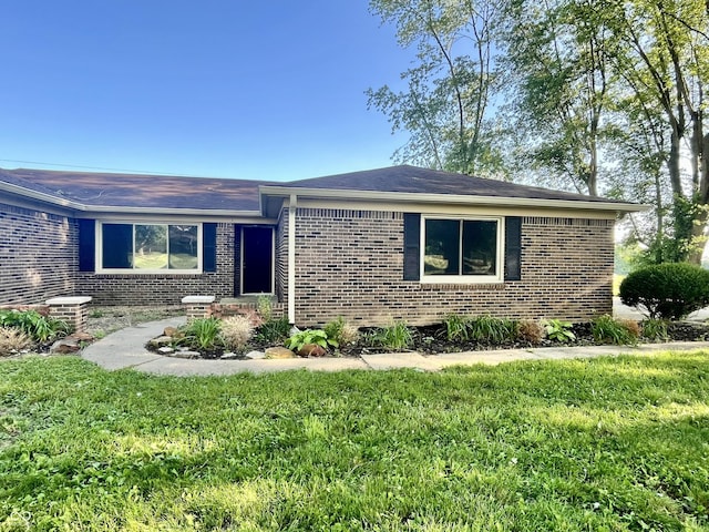 15841 E 265 N, Columbus, IN 47203 - ranch-style home with brick siding, a front yard, and a shingled roof