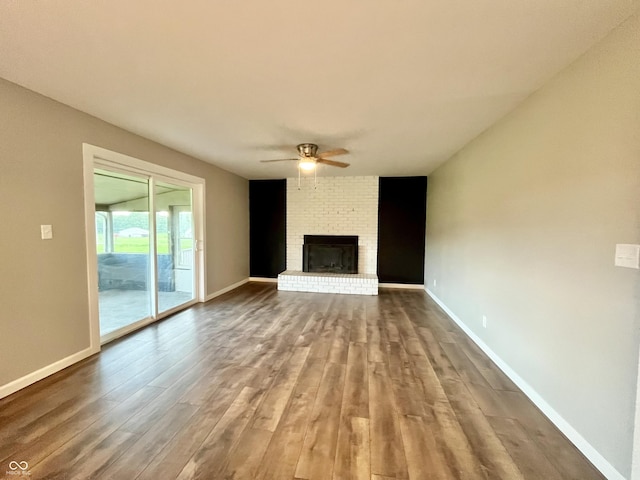 15841 E 265 N, Columbus, IN 47203 - unfurnished living room with a ceiling fan, wood finished floors, and a fireplace