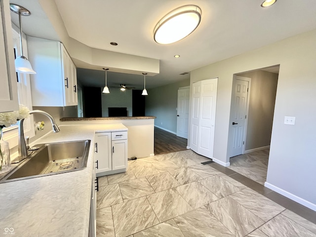 15841 E 265 N, Columbus, IN 47203 - kitchen featuring white cabinets, hanging light fixtures, a peninsula, recessed lighting, and light marble finish floors