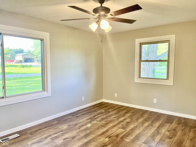 15841 E 265 N, Columbus, IN 47203 - empty room featuring healthy amount of natural light, wood finished floors, and ceiling fan