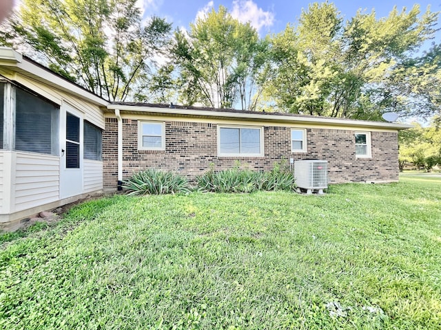 15841 E 265 N, Columbus, IN 47203 - rear view of house featuring brick siding and a lawn
