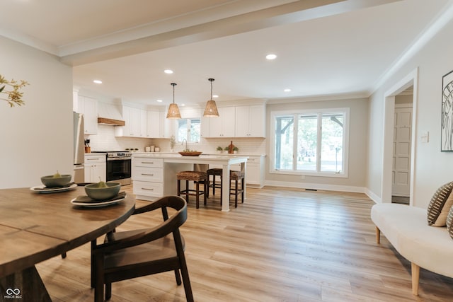 14407 Bryn Mawr Dr, Fishers, IN 46038 - dining space featuring crown molding, healthy amount of natural light, light wood-style flooring, and recessed lighting
