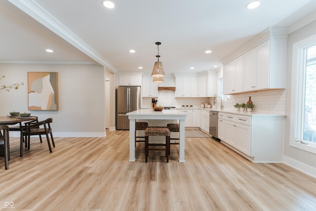 14407 Bryn Mawr Dr, Fishers, IN 46038 - kitchen featuring appliances with stainless steel finishes, decorative backsplash, white cabinetry, recessed lighting, and ornamental molding