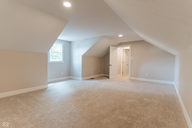14407 Bryn Mawr Dr, Fishers, IN 46038 - additional living space with lofted ceiling, light colored carpet, and recessed lighting