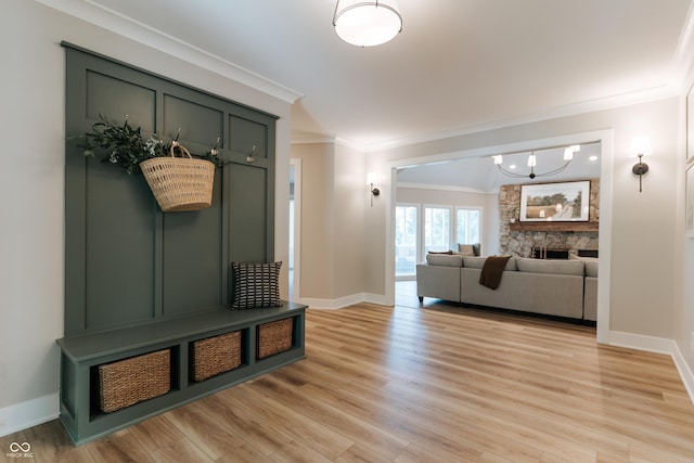 14407 Bryn Mawr Dr, Fishers, IN 46038 - mudroom with crown molding, light wood-style flooring, and a chandelier