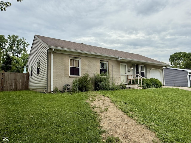 1816 Hemlock Ln, Plainfield, IN 46168 - view of front of home with an attached garage, brick siding, and driveway