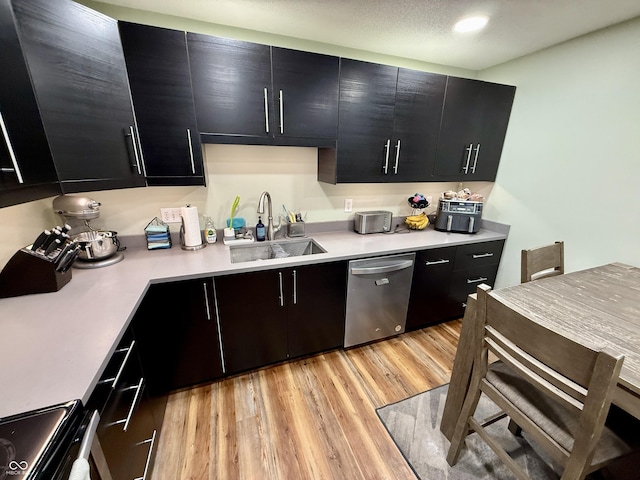 1816 Hemlock Ln, Plainfield, IN 46168 - kitchen featuring stainless steel dishwasher, dark cabinetry, stove, light countertops, and recessed lighting