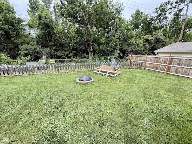 1816 Hemlock Ln, Plainfield, IN 46168 - fenced backyard with an outdoor fire pit