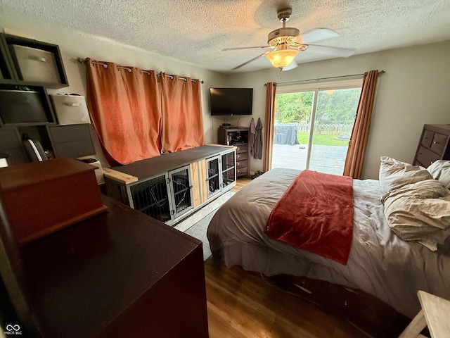1816 Hemlock Ln, Plainfield, IN 46168 - bedroom with access to exterior, wood finished floors, a textured ceiling, and a ceiling fan