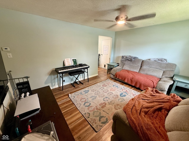 1816 Hemlock Ln, Plainfield, IN 46168 - living room featuring ceiling fan, wood finished floors, and a textured ceiling
