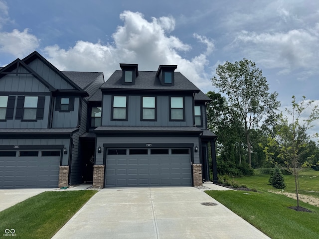 9751 Behner Dr, Fishers, IN 46250 - view of front of home with brick siding, board and batten siding, and driveway