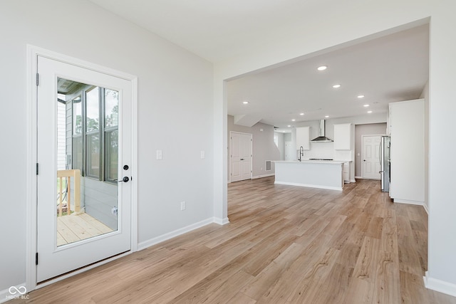 9751 Behner Dr, Fishers, IN 46250 - unfurnished living room with light wood-style flooring and recessed lighting
