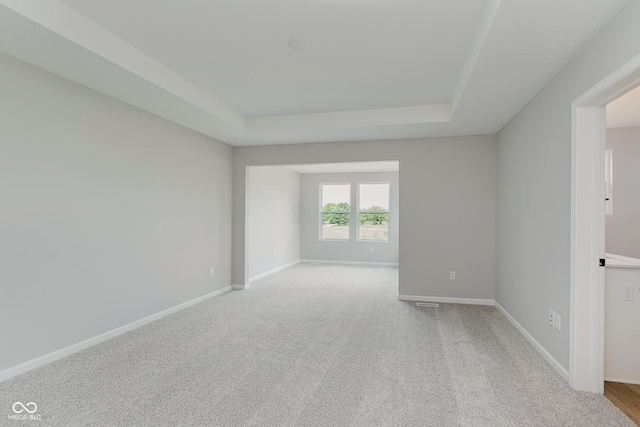 9751 Behner Dr, Fishers, IN 46250 - carpeted spare room with a tray ceiling and baseboards